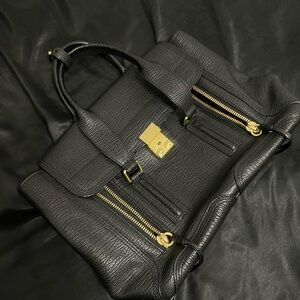 Black Leather Handbag with Gold Accents